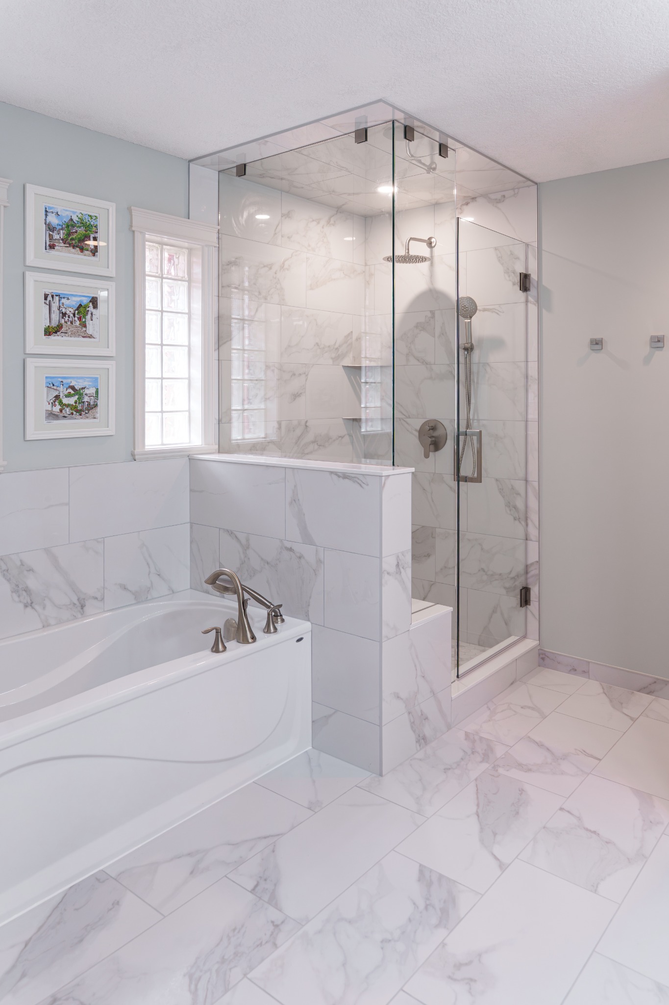 Completed bathroom renovation with a glass shower