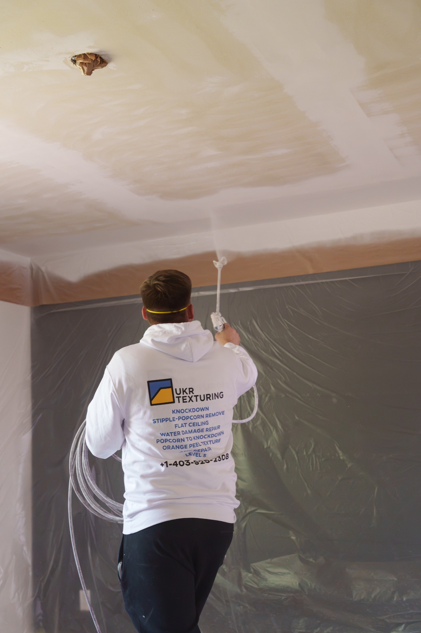 Interior finishing professional working on a ceiling